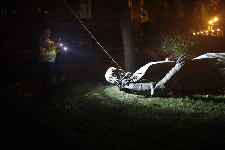 The statue of a Confederate general, Albert Pike, after it was toppled by protesters and set on fire in Washington, D.C., on  June 20. (AP Photo/Maya Alleruzzo)