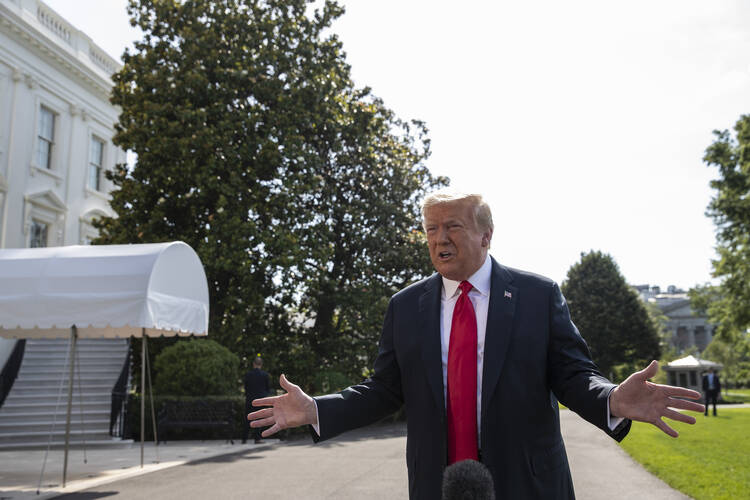 President Donald Trump speaks with reporters before departing on Marine One on the South Lawn of the White House, Tuesday, June 23, 2020, in Washington. (AP Photo/Alex Brandon)