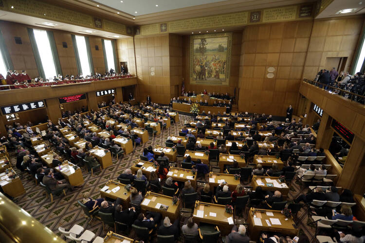 Oregon Gov. Kate Brown delivers her inaugural speech to Oregon legislators in the Capitol House chambers in Salem, Ore., on Jan. 9. Insurance companies in Oregon would be required to cover abortions and a variety of other reproductive services at no cost to the patient under a $10 million reproductive health bill approved by the state Legislature. (AP Photo/Don Ryan, File)