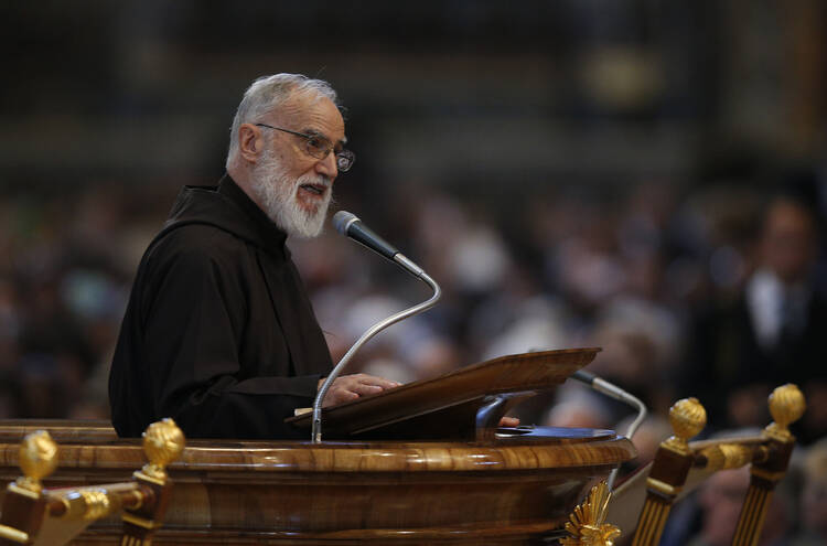  Capuchin Franciscan Father Raniero Cantalamessa, preacher of the papal household, gives the homily during the Good Friday service led by Pope Francis in St. Peter's Basilica at the Vatican April 14. (CNS photo/Paul Haring)
