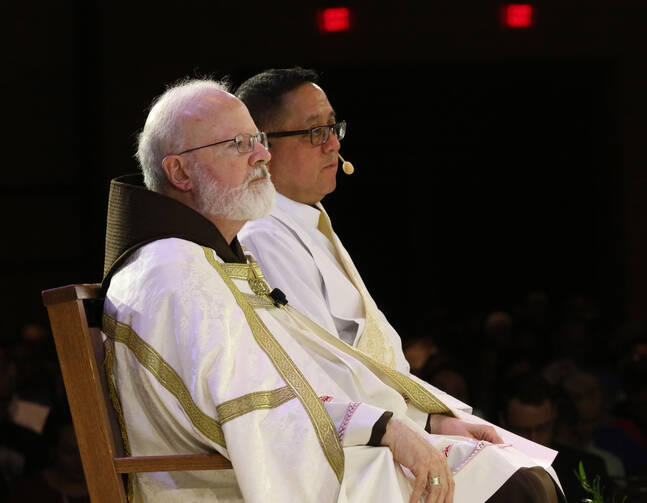 Boston Cardinal Sean P. O'Malley and Deacon Bernie Nojadera, executive director of the U.S. bishops' Secretariat for Child and Youth Protection, are pictured during the 2017 Catholic convocation in Orlando, Fla.  (CNS photo/Bob Roller)
