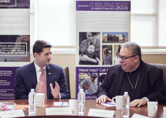 House Speaker Paul Ryan, R-Wis., visits with Bishop Michael F. Olson of Fort Worth, Texas, at Catholic Charities Fort Worth campus, April 3 (CNS photo/Juan Guajardo, North Texas Catholic Magazine).