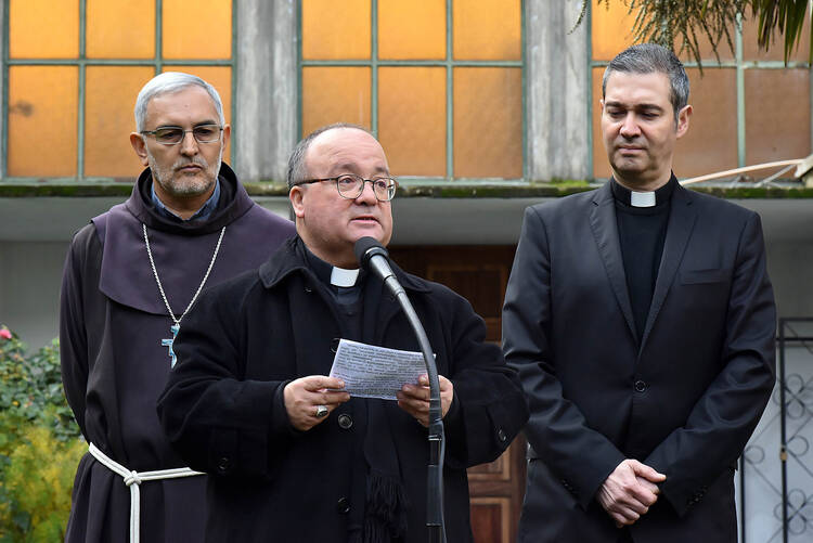  Auxiliary Bishop Jorge Concha Cayuqueo, the apostolic administrator for the Diocese of Osorno, Chile, and Archbishop Charles Sciclunaand Father Jordi Bertomeu Farnos, Vatican envoys, are pictured in Osorno, Chile, June 17. (CNS photo/courtesy Archdiocese of Santiago) 