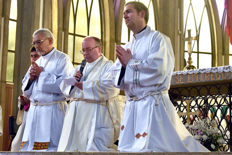 Archbishop Charles Scicluna, center, has been chosen as part of a steering committee to lead the meeting of bishops’ conferences from around the world in February. (CNS photo/courtesy Archdiocese of Santiago) 