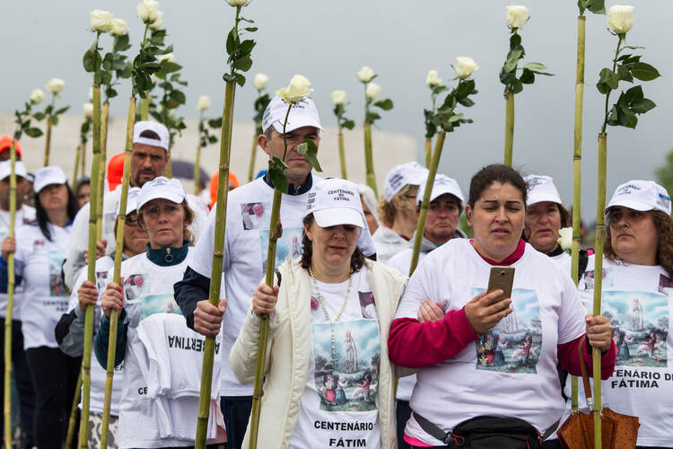 Pilgrims arrive at the Marian shrine of Fatima May 10 in central Portugal (CNS photo/Paulo Cunha, EPA).