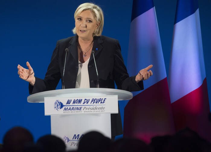 Marine Le Pen, leader of the far-right National Front, delivers a speech in Henin-Beaumont, France, April 23, after the first round of the French presidential elections. (CNS photo/Oliver Hoslet, EPA)