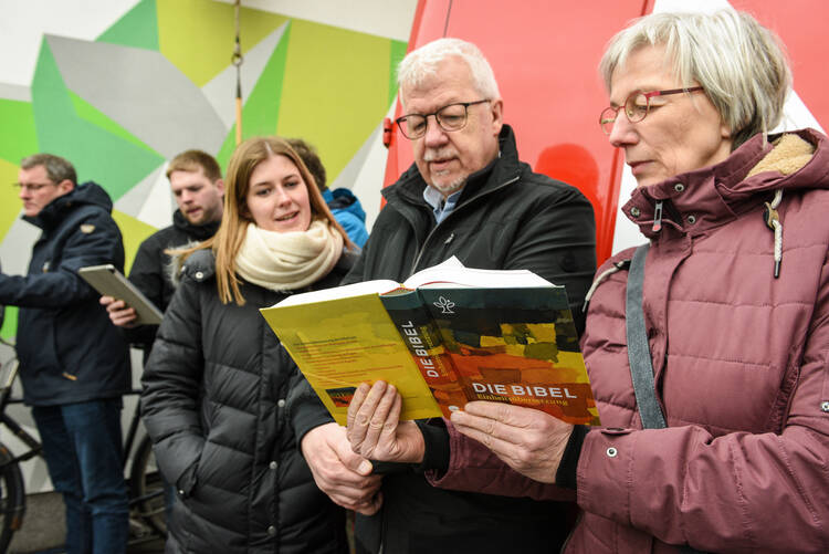 Demonstrators stand outside the German bishops' spring meeting in Lingen, March 11. The sexual abuse scandal and demands for reform have changed the German church, Cardinal Reinhard Marx of Munich said March 14. (CNS photo/Harald Oppitz, KNA) 