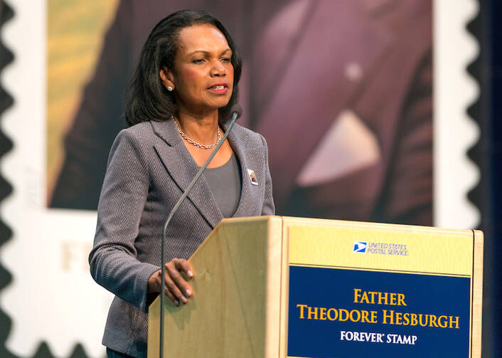 Condoleezza Rice addresses a Sept. 1 ceremony at the University of Notre Dame where a new postage stamp honoring Father Theodore Hesburgh was issued (CNS photo/courtesy Barbara Johnston, University of Notre Dame).