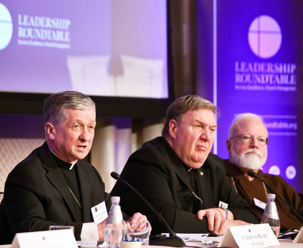Chicago Cardinal Blase J. Cupich, left, speaks during a Feb. 1, 2019, panel discussion at the Leadership Roundtable's Catholic Partnership Summit in Washington to put forth possible solutions to the church's sex abuse crisis.  (CNS photo/Ralph Alswang, courtesy Leadership Roundtable) 