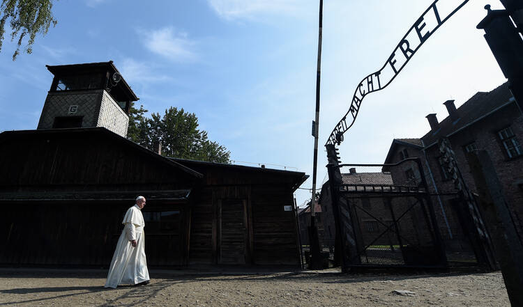 Pope Francis enters the main gate of the Auschwitz Nazi death camp in Oswiecim, Poland, July 29, 2016 (CNS photo/Alessia Giuliani, pool).