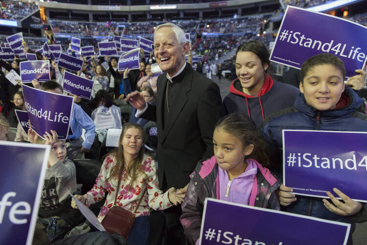 Washington Cardinal Donald W. Wuerl greets young people during a pro-life youth rally and Mass at Capital One Arena in Washington Jan. 19 before the annual March for Life. (CNS photo/Jaclyn Lippelmann, Catholic Standard) 
