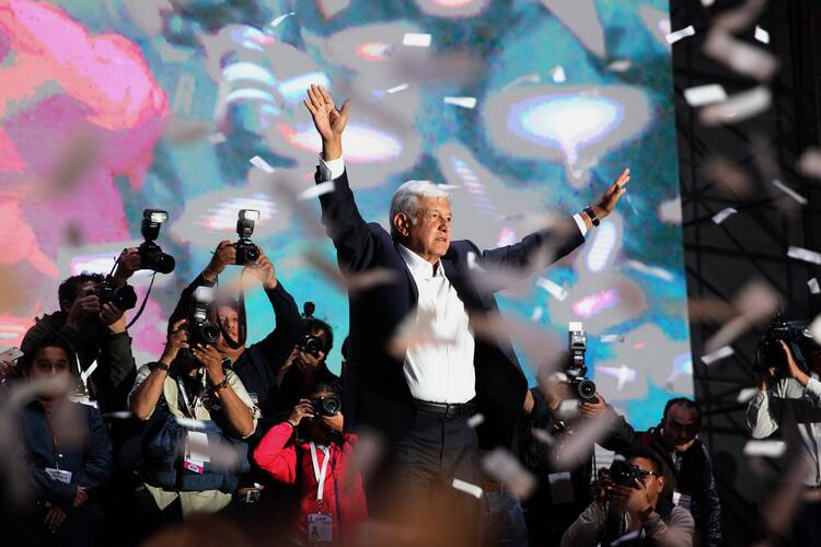 Andres Manuel Lopez Obrador, the new president of Mexico, celebrates with his supporters July 1 after his victory in Mexico City. (CNS photo/Alex Cruz, EPA)