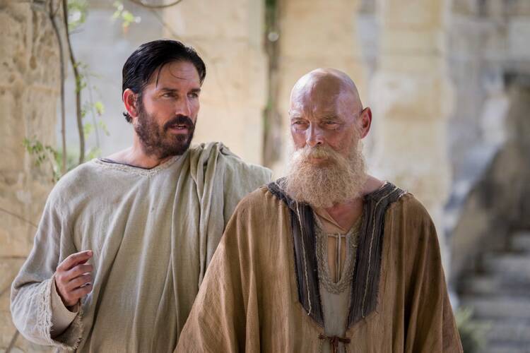 Jim Caviezel as Luke and James Faulkner as Paul are seen in the film "Paul, Apostle of Christ." (CNS photo/Sony Pictures) 