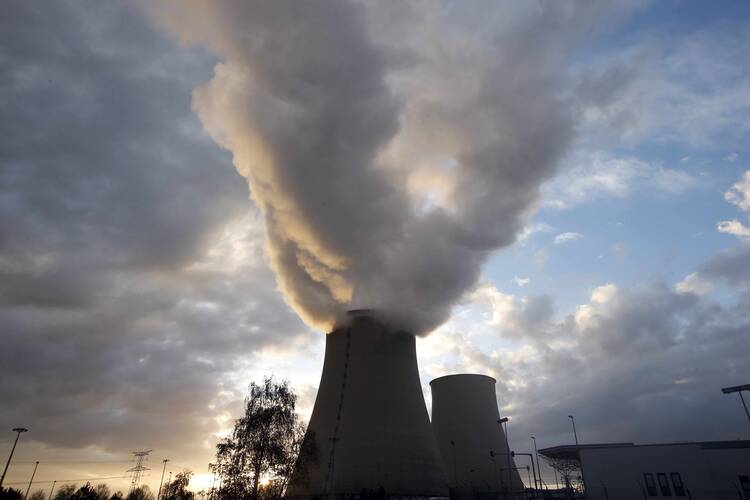 Steam rises from the cooling towers of a nuclear power station in Nogent-Sur-Seine, France. (CNS photo/Charles Platiau, Reuters)
