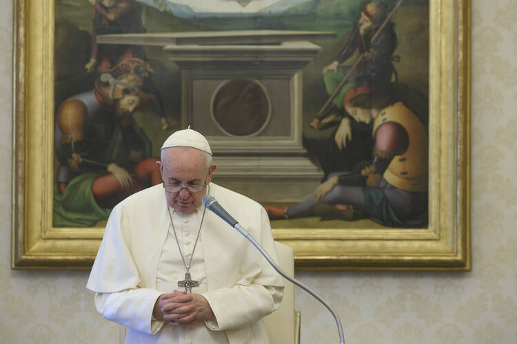  Pope Francis holds his weekly general audience April 22, 2020, in the papal library in the Apostolic Palace. Marking the celebration of Earth Day, the pope dedicated his audience talk to urging people to protect the earth and its inhabitants. (CNS photo/Vatican Media) 