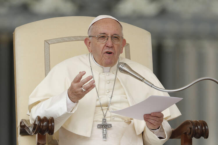  Pope Francis speaks during his general audience in St. Peter's Square at the Vatican on April 18. (CNS/Paul Haring)