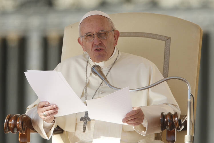 Pope Francis speaks during his general audience in St. Peter's Square at the Vatican Oct. 11. (CNS photo/Paul Haring)