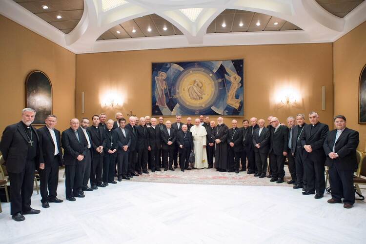  Pope Francis poses for a photo with Chilean bishops at the Vatican May 17. (CNS photo/Vatican Media)