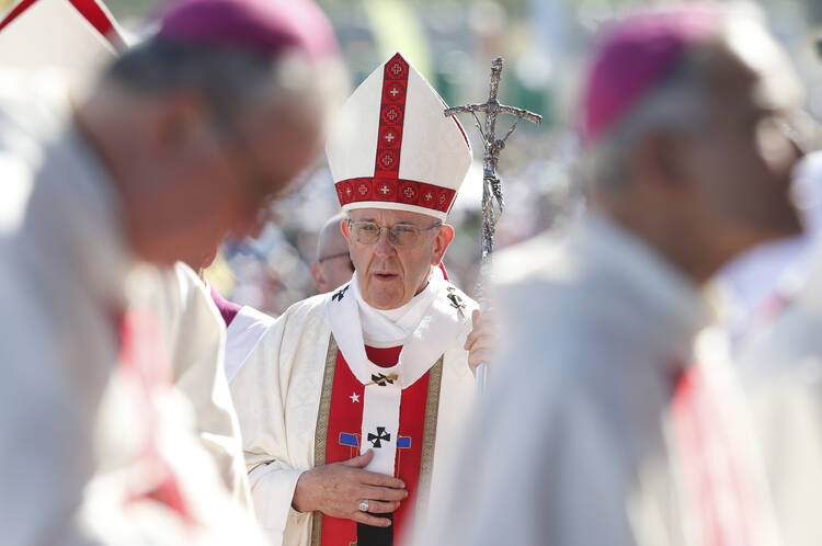 Pope Francis arrives in procession with other bishops during Mass at the Maquehue Airport near Temuco, Chile, Jan. 17. (CNS photo/Paul Haring)