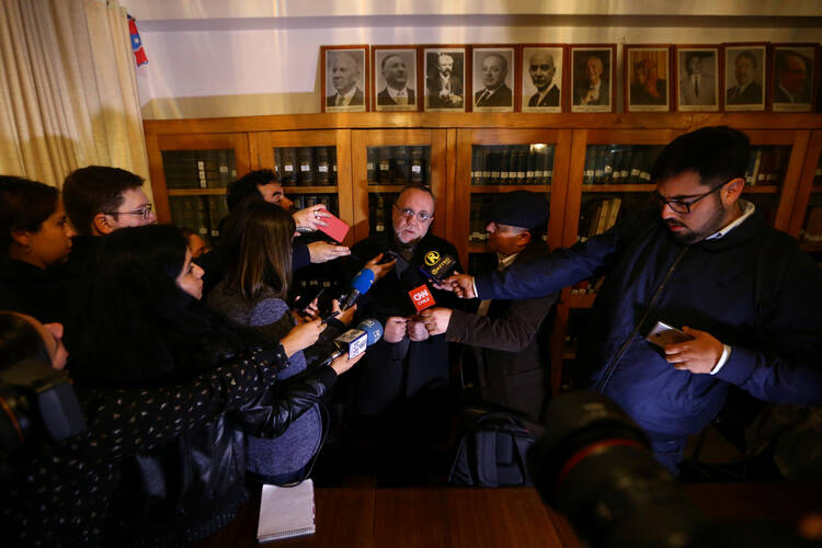 Chilean Father Francisco Astaburuaga Ossa talks with the media May 23 in Santiago after receiving an invitation to meet with Pope Francis at the Vatican to discuss the sexual abuse scandal. (CNS photo/Ivan Alvarado, Reuters) 