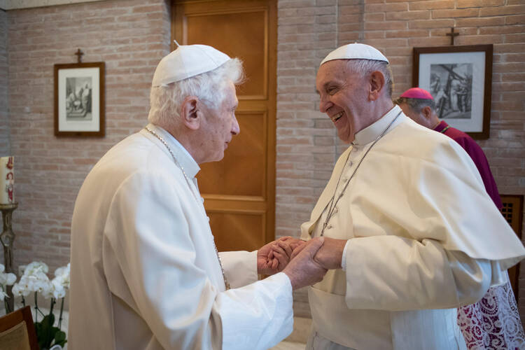 Pope Francis greets Pope Emeritus Benedict XVI during a visit with new cardinals at the retired pope’s residence, Nov. 19, 2016 (CNS photo/L'Osservatore Romano, handout).