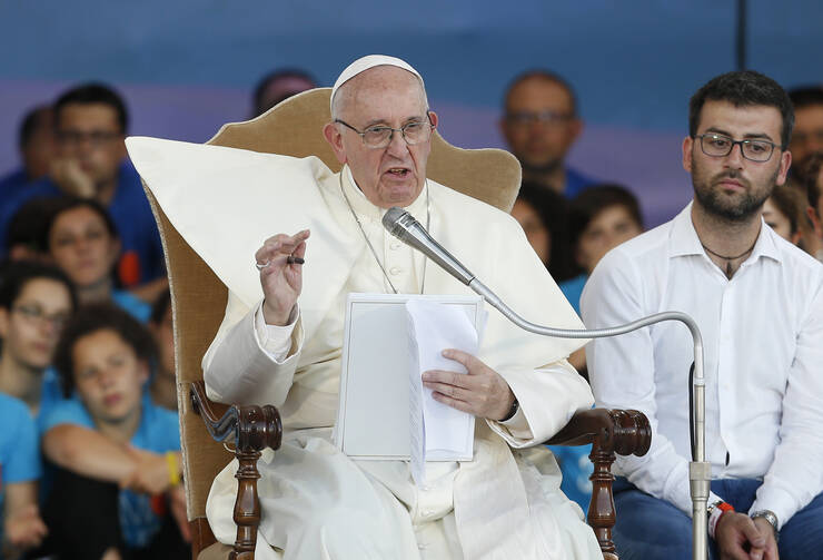 Pope Francis speaks during an evening meeting with Italian young adults at the Circus Maximus in Rome Aug. 11. (CNS photo/Paul Haring)