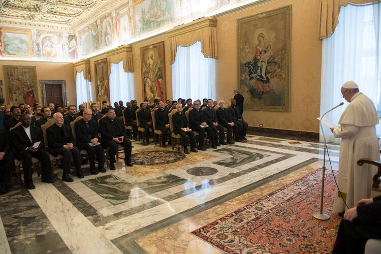 Pope Francis leads an audience with faculty and staff of the Jesuits' International College of the Gesu at the Vatican Dec. 3. (CNS photo/Vatican Media)
