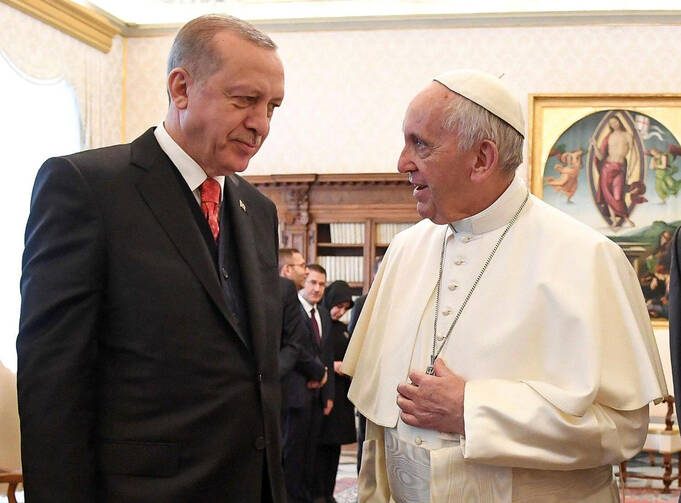 Pope Francis talks with Turkish President Tayyip Erdogan during a private meeting Feb. 5 at the Vatican. (CNS photo/Alessandro Di Meo via Reuters)