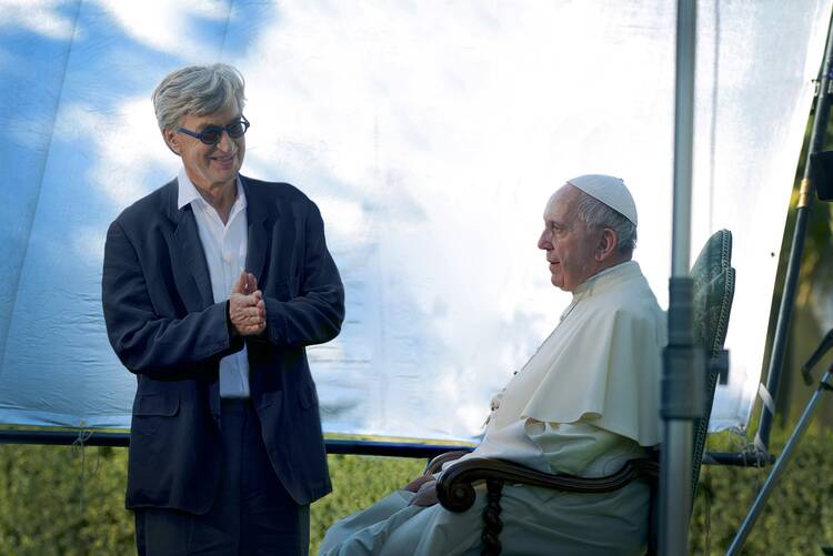 German filmmaker Wim Wenders is pictured in this undated photo with Pope Francis during the production of his documentary film, "Pope Francis — A Man of His Word." (CNS photo/Vatican Media, handout)