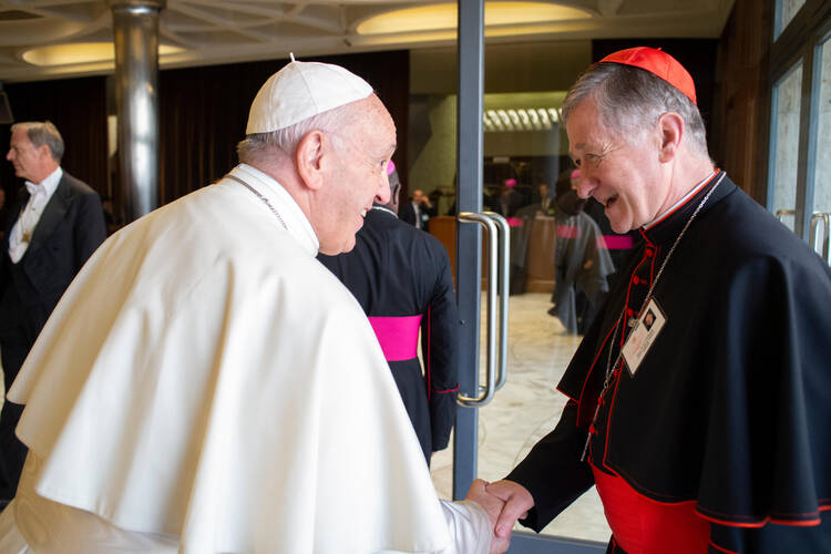  10.17.2018 Pope Francis greets Cardinal Blase J. Cupich of Chicago before a session of the Synod of Bishops on young people, the faith and vocational discernment at the Vatican Oct. 16. (CNS photo/Vatican Media)