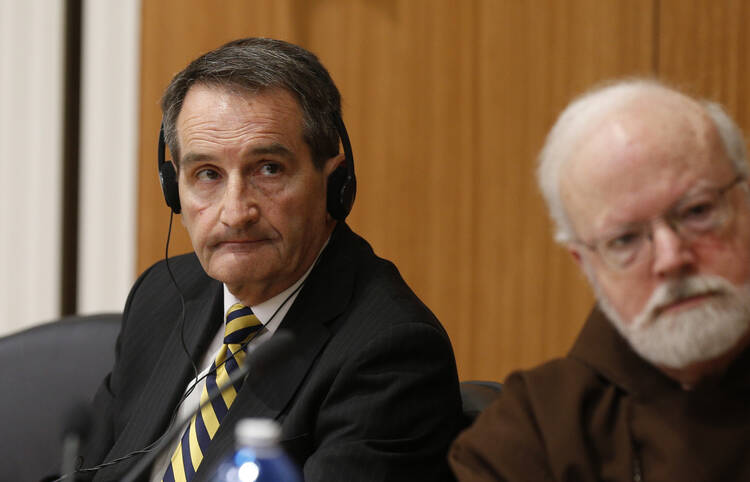 Francis Sullivan and Cardinal Sean P. O'Malley attend a seminar on safeguarding children at the Pontifical Gregorian University in Rome March 23 (CNS photo/Paul Haring).