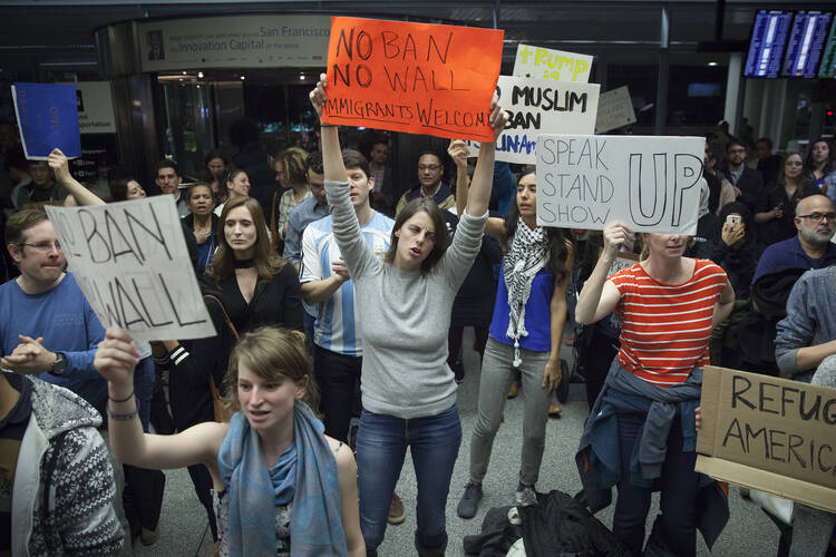 A protest at the Arrivals Hall of San Francisco's International Airport (CNS photo/Peter Dasilva, EPA) 