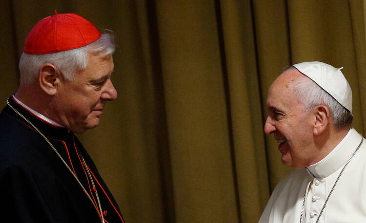 Cardinal Gerhard Müller greeting Pope Francis during the 2014 synod on the family. (CNS photo/Paul Haring)