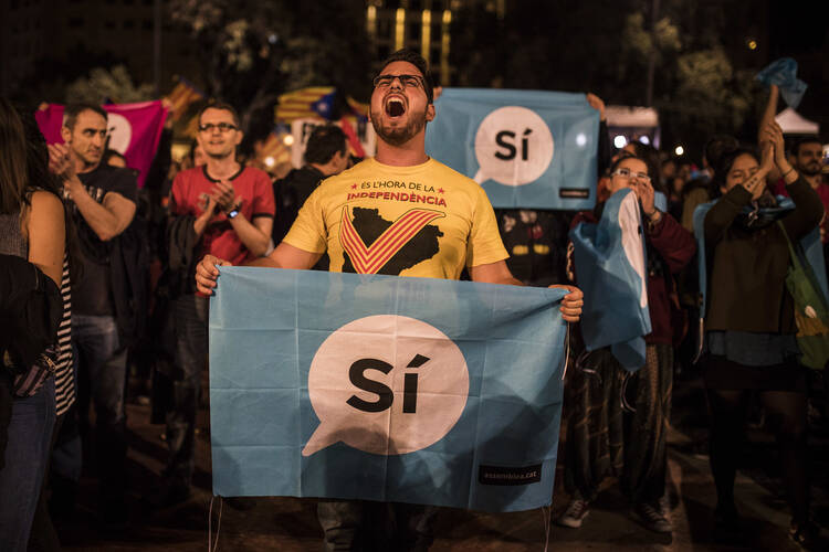 Catalan independence supporters gather in Barcelona's main square on Oct. 1. (AP Photo/Santi Palacios)