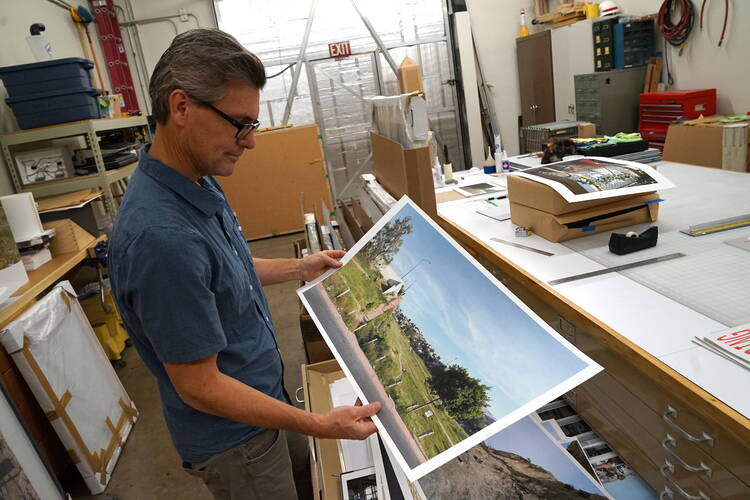 Photographer David Taylor talks about his work on the U.S.-Mexico border in studio in Tucson, Ariz. (J.D. Long-García) 