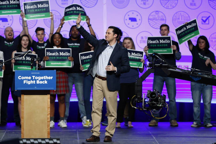 Omaha Democratic mayoral candidate Heath Mello waves to supporters at a rally on April 20.  (AP Photo/Charlie Neibergall)