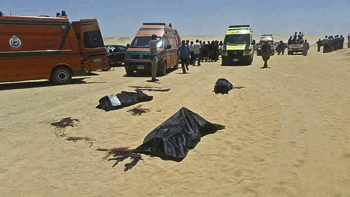 This image released by the Minya governorate media office shows bodies of victims killed when gunmen stormed a bus in Minya, Egypt, Friday, May 26, 2017 (Minya Governorate Media office via AP).