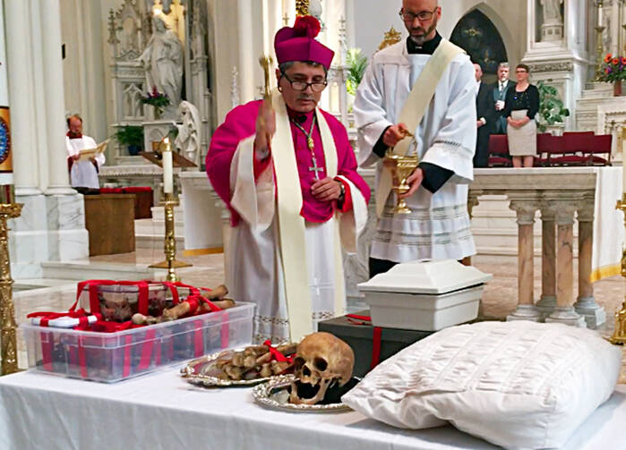 Auxiliary Bishop Jorge H. Rodriguez-Novelo blesses the remains of Julia Greeley in the Cathedral Basilica of the Immaculate Conception in Denver on Wednesday, June 7, 2017. (AP Photo/Colleen Slevin)