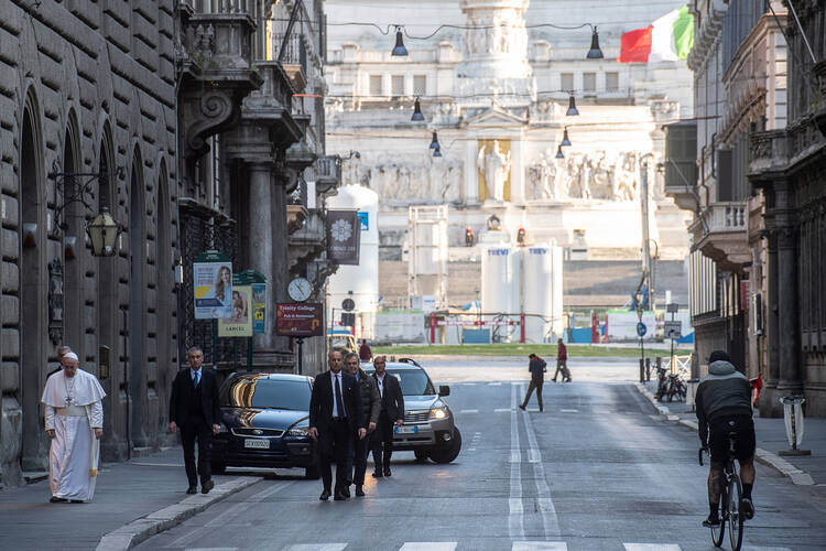 Pope Francis walks the nearly deserted streets of Rome in late afternoon on March 15. (Copyright: Vatican Media)