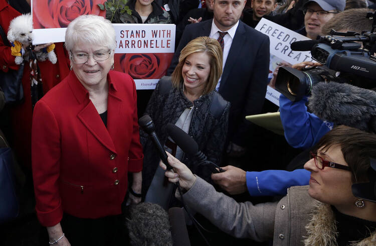 Barronelle Stutzman, left, meets with supporters outside Washington's state Supreme Court. (AP Photo/Elaine Thompson, File)