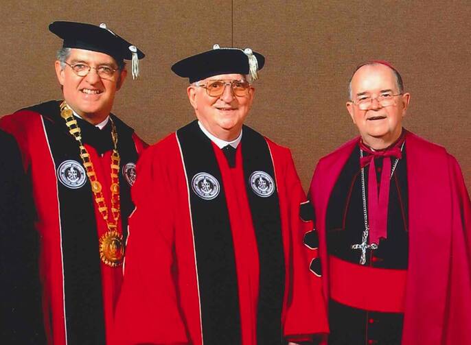 Dr. Joseph J. McGowan, president of Bellarmine University, Patrick Hart, O.C.S.O., and Archbishop Thomas Kelly during the ceremony at which Brother Hart received an honorary degree from Bellarmine University on May 10, 2003. (Courtesy of Bellarmine University)