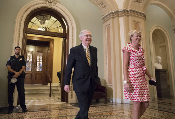 Senate Majority Leader Mitch McConnell, R-Ky. walks from the Senate Chamber on Capitol Hill in Washington, Tuesday, July 25, 2017, as he steers the Senate toward a crucial vote on the Republican health care bill. (AP Photo/J. Scott Applewhite)