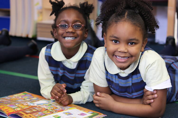 Lala Bonner and River Parks are all smiles at Chicago’s St. Ethelreda Catholic School. St. Ethelreda’s is among 30 schools that will benefit from a new financial partnership between the Big Shoulders Fund and the Archdiocese of Chicago. Photo courtesy of the Big Shoulders Fund.