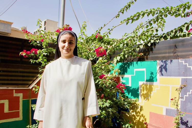 Sister Nazik Matty in her garden in Erbil. Photo by Kevin Clarke.