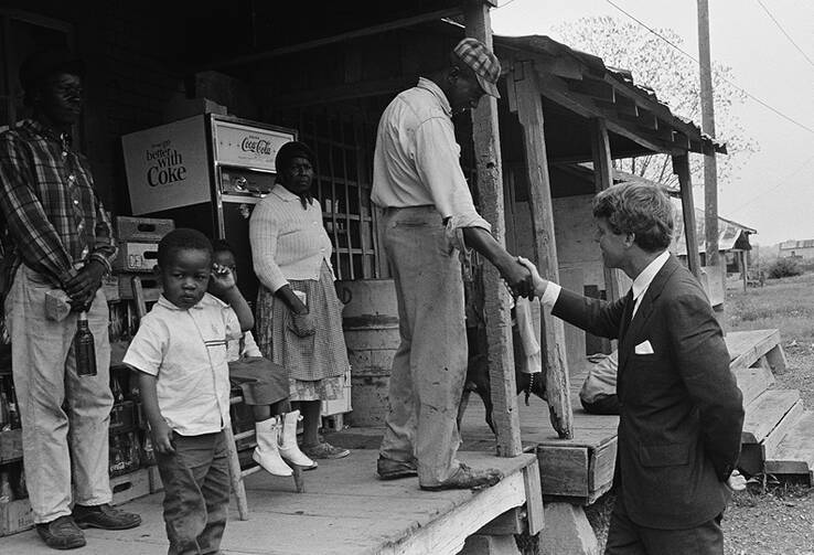 Sen. Robert F. Kennedy meets a resident of Greenville, Miss., in April 1967. (AP Photo/Jack Thornell)