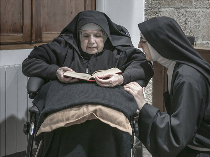 Sister Maria Giuseppina (left) and Sister Maria Caterina (right) are among 10 remaining nuns in a convent on the island of Sardinia who are breaking their silence and embracing the internet in an effort to ensure their order’s survival. This photo is from an exhibition being held at the Santa Chiara convent in Sardinia. Photo courtesy of Gabriele Calvisi.