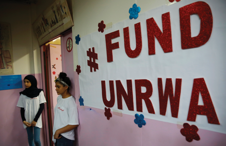 Palestinian refugee students stand outside a classroom in Beirut, Lebanon, on Sept. 3. (AP Photo/Hussein Malla) Image: Palestinian refugee students stand outside a classroom in Beirut, Lebanon, on Sept. 3. (AP Photo/Hussein Malla)