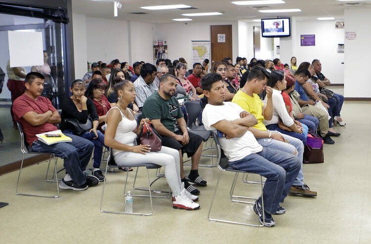 Mexican nationals at the Mexican Consulate General in Miami, which is offering legal assistance centers in response to President Donald Trump's measures to deport undocumented migrants. (AP Photo/Alan Diaz)