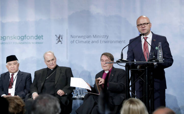 Norway's Minister of Climate and Environment Vidar Helgesen speaks during the Interfaith Rainforest Initiative in Oslo, Norway, on Monday June 19, 2017. Religious and indigenous leaders worldwide are calling for an end to deforestation in an international multi-faith, multi-cultural plea to reduce the emissions that fuel climate change, which is killing tropical rainforests.(Lise Aserud/NTB Scanpix via AP)
