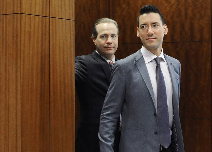In this April 29, 2016 file photo, David Robert Daleiden, right, leaves a courtroom after a hearing in Houston.  (AP Photo/Pat Sullivan, File)